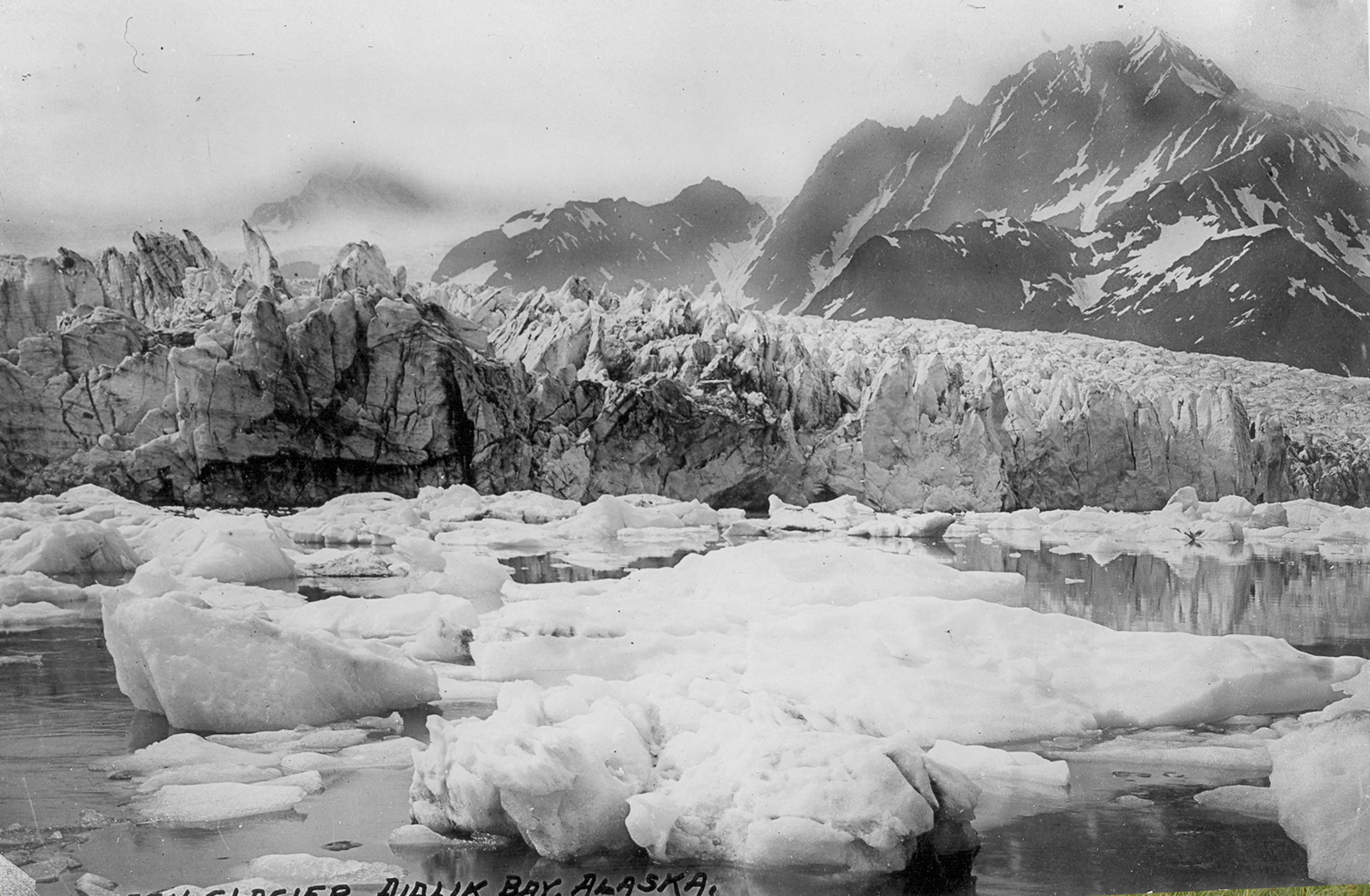 Pedersen Glacier, Alaska, calving into the lagoon in 1920